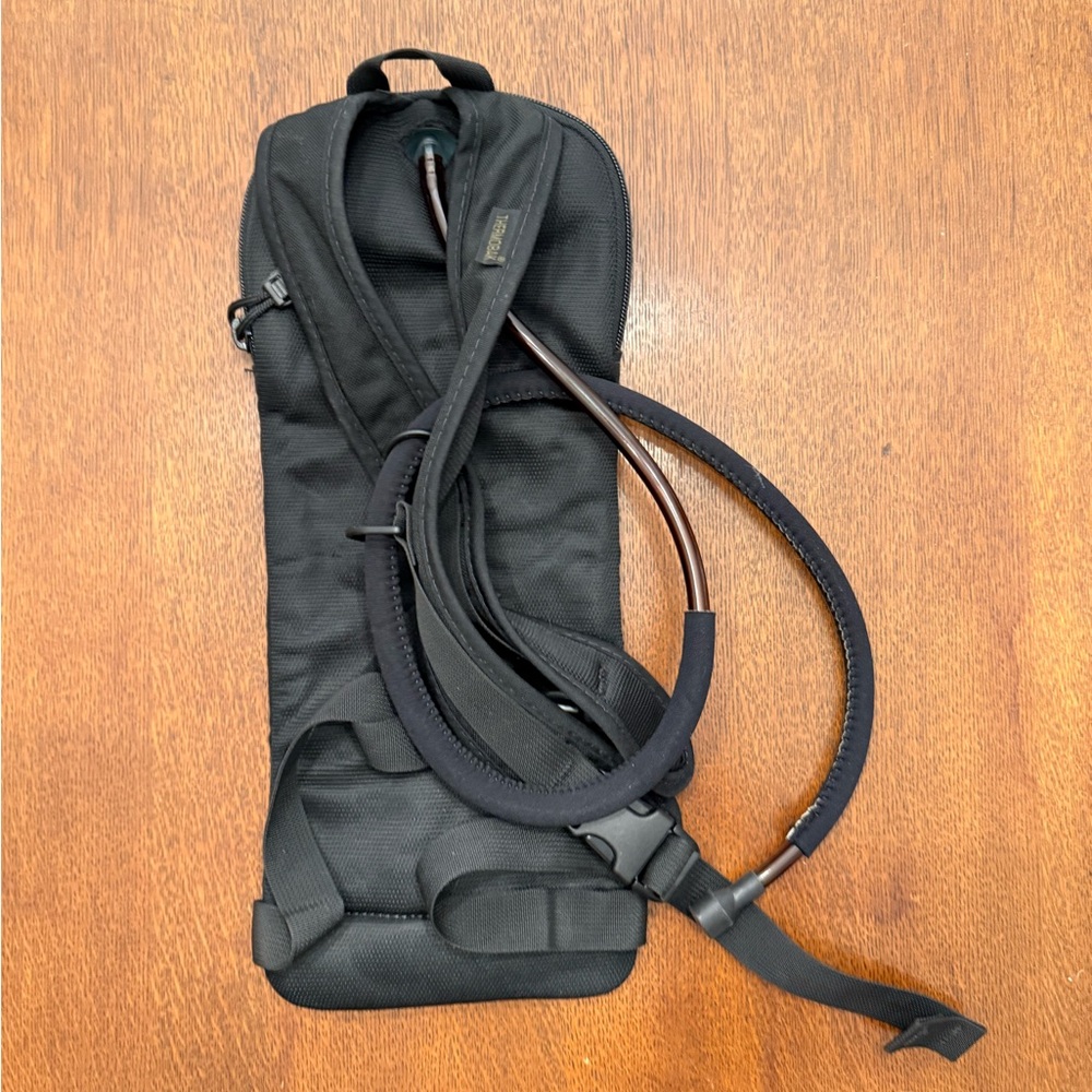 DADS ESTATE SALE: Never used Camelbak with bladder, about 17” x 7”. - Picture 4 of 5